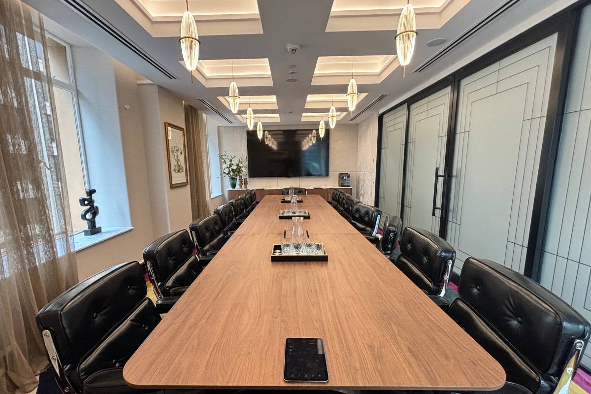 Boardroom with timber table, leather chairs, coffered ceiling and pendant lighting